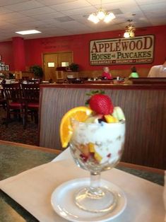 a dessert in a glass on top of a table