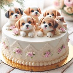 there are four puppies sitting on top of the cake