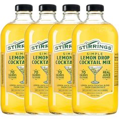 three bottles of lemon drop cocktail are shown in this undated image with the same label