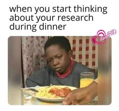 a man sitting at a table with a plate of food in front of him and the caption reads, when you start thinking about your research during dinner