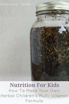 a jar filled with herbs sitting on top of a white table next to a sign that says nutrition for kids how to make your own herb children's multi - vitamin formula