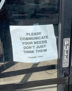 a sign is posted on the glass door of a public transit bus that says, please communicate your needs don't just think them thank you