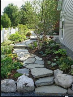 a stone path in front of a house