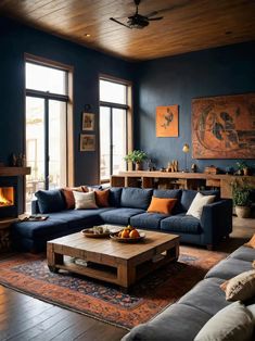 a living room filled with furniture and a fire place in the middle of the room