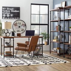 a room with a desk, chair and bookshelf