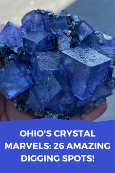 a person holding up a blue rock with the words, oho's crystal marvels 26 amazing digging spots