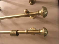 two brass colored handles on the side of a door