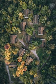 an aerial view of houses in the woods