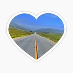 a heart shaped sticker with an empty road in the middle