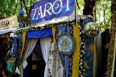 there is a tent that says tarot on the front and sides with decorations around it