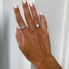 "Our hand chain designs are made with shiny 18k gold plated or platinum plated  chain that is comfortable, lightweight and beautiful. A lovely and minimalist finger bracelet that dazzles so delicately on your hand. We have always been obsessed with hand chains so we created our own. Hand chains are so dainty and give that extra sparkle and shine to your everyday look.  Measurements:  Bracelet - 6.5-7\" inches (comes with extra adjustable 2\" chain extender) Wrist to finger - 7 cm Please feel free to send us over your measurements and we will make it a perfect fit for you! Message us or leave a note on your order with your measurements ♡ Material: Stainless Steel Finish: 18K Gold Plating / Platinum Plating -  PROCESSING TIME -  This piece is handmade to order and is ready to ship in 1-2 bus Gold Hand Bracelet, Gold Hand Chain, Finger Bracelets, Real Gold Jewelry, Hand Bracelet, Bracelet Chain, Gold Hand, Chain Extenders, Jewelry Lookbook