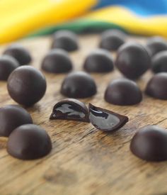 chocolate candies on a wooden cutting board