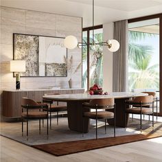 a dining room table with chairs and a rug on the floor in front of it