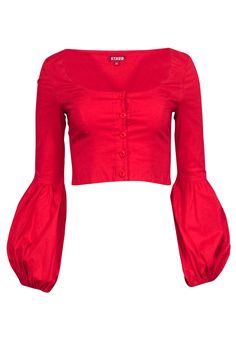 Add a pop of color to your wardrobe with Staud's Monica Top! Made from vibrant red cotton-poplin, this button-up top oozes bohemian charm with its flattering scoop neckline, voluminous cuffs, and cropped silhouette. Pairs perfectly with light wash denim and open-toe mules for a lovely look. Size XS 95% Cotton, 5% Spandex Button front Scoop neckline Cropped style Voluminous sleeves w/ elastic cuffs Bust 31" Waist 26" Shoulder to hem 15.5" Sleeve length 24.5" Summer Cotton Tops By Staud, Staud Cotton Tops For Summer, Chic Cotton Tops By Staud, Chic Staud Cotton Tops, Spring Red Cotton Top, Red Cotton Spring Tops, Red Cotton Top For Spring, Red Cotton Top For Summer, Festival Cotton Tops With Buttons