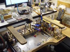 the workbench is full of many different tools