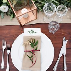 a place setting with napkins and silverware