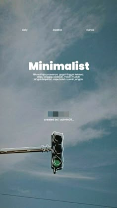 a traffic light with the word minimalist above it in front of a cloudy sky