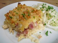 a white plate topped with food on top of a wooden table