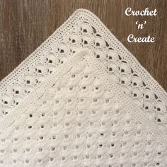 a crocheted blanket on top of a wooden floor with the words crochet in