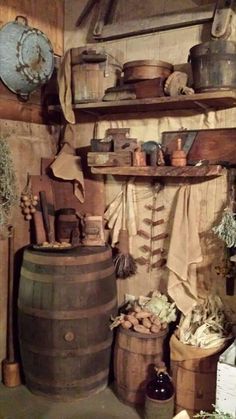 an old fashioned kitchen with lots of pots and pans