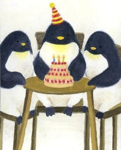 three penguins sitting at a table with a birthday cake