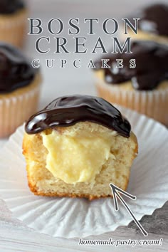 boston cream cupcakes on a paper plate with chocolate frosting in the middle