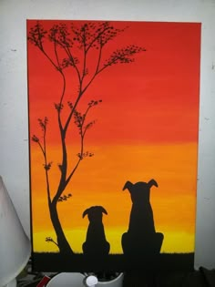 two dogs sitting under a tree in front of an orange and yellow sunset painted on canvas