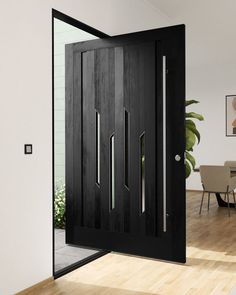 an open black door in the middle of a room