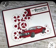 a red car with gears on it and the words, all yearred up to celebrate