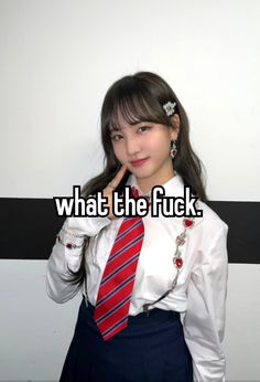 a girl wearing a skirt and tie with the caption what the fock?