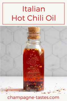 a bottle filled with hot chili oil sitting on top of a table