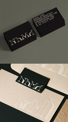 two different business cards with black and white designs on them, one has the letter d