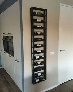 a wine rack in the corner of a room