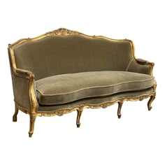 an old fashioned couch with gold trimmings on the back and arms, sitting in front of a white background