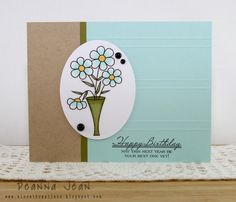 a card with flowers in a vase on it