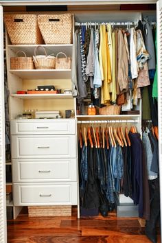 an organized closet with clothes and baskets