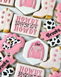 decorated cookies with pink and black designs on them