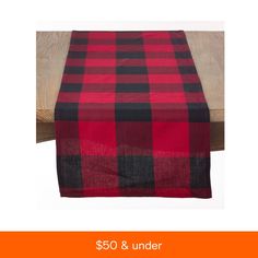 a red and black checkered table runner with the words $ 50 & under on it