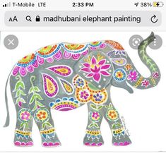 an elephant painted in bright colors with paisley patterns