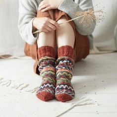 The sustainable 100% wool LUGA socks come well past the ankle. Wear them in bed, around the house or peeking out of winter boots. Please note that these socks do not have reinforced soles and are designed for lounging - if you are on your feet all day our hand felted slippers are a more suitable choice. See other listings for matching items. Handmade by artisans within a World Fair Trade Organisation certified collective in Kathmandu, Nepal. Our hand-knitted products are made by women who knit t Felted Slippers, Orange Design, Hand Felted, Patterned Socks, Rust Orange