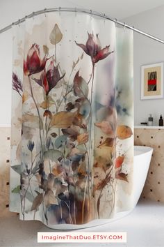 a shower curtain with watercolor flowers on it in a white bathroom, next to a bathtub