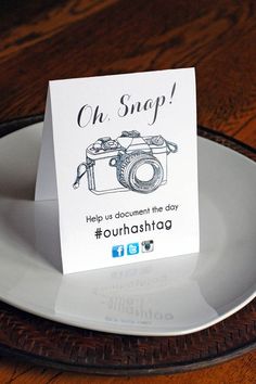 a white plate with a card on it that says oh snap help us document the day