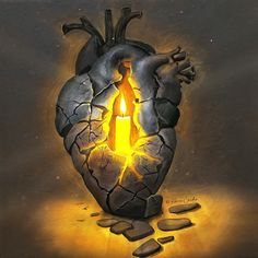 a lit candle in the shape of a human heart