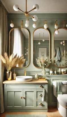 a bathroom with green walls and gold fixtures