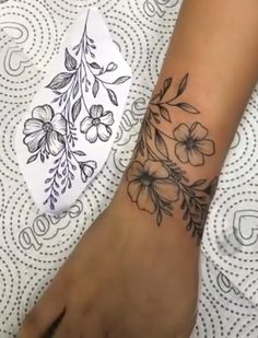 a person with a flower tattoo on their arm