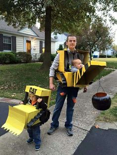 a man and his son are dressed up as construction workers