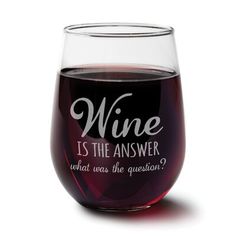 a wine glass with the words wine is the answer and what does the question?