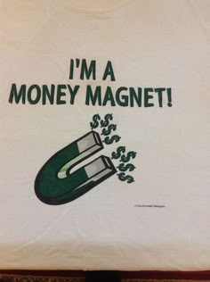 i'm a money magnet t - shirt in white with green writing on the front