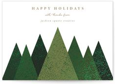 a holiday card with green trees and the words happy holidays