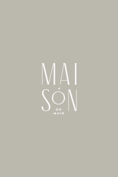 the logo for mai son on main, which has been changed to white and black